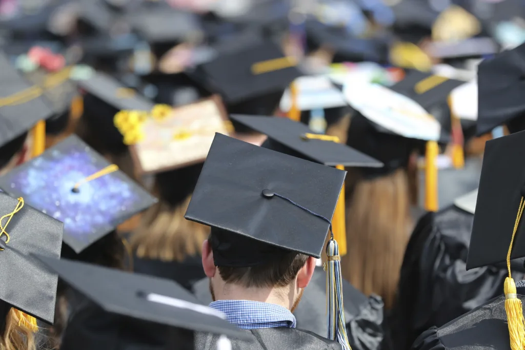 In this May 5, 2018, file photo, graduates at the University of Toledo commencement ceremony in Toledo, Ohio. (AP Photo/Carlos Osorio, File)