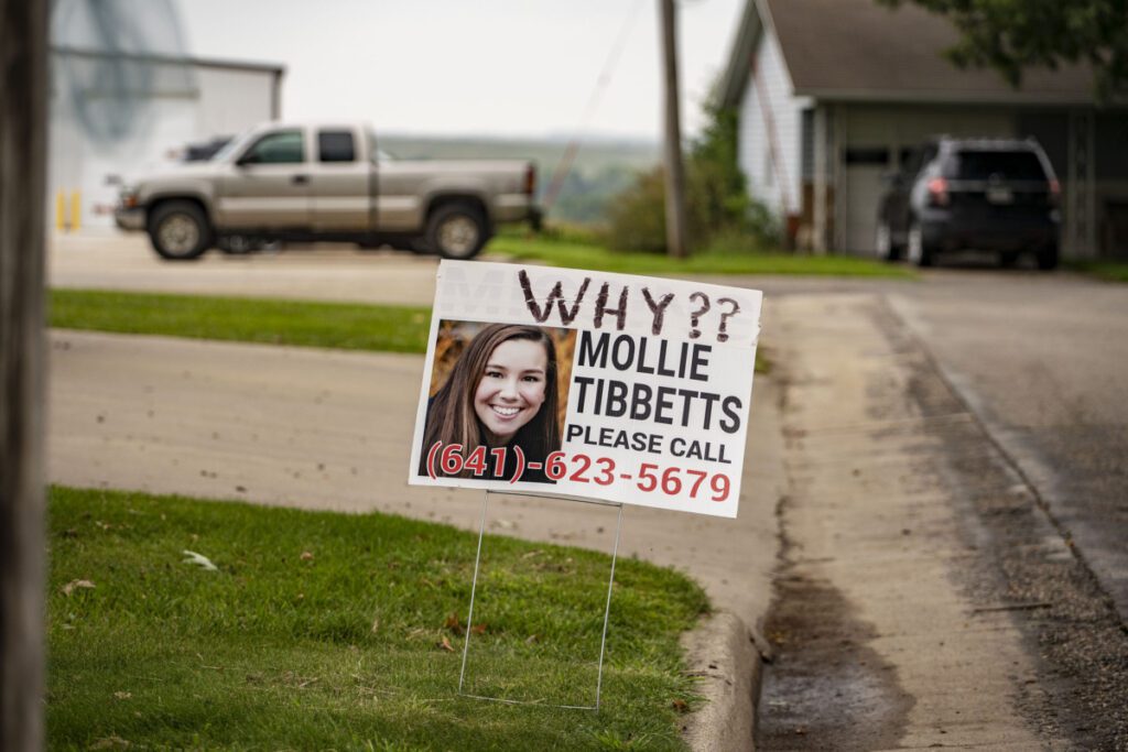 a sign seeking info for mollie tibbetts in iowa